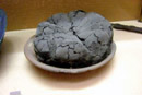 Gay tours - Loaf of bread discovered in Pompeii, now exhibited in the Antiquarium Boscoreale